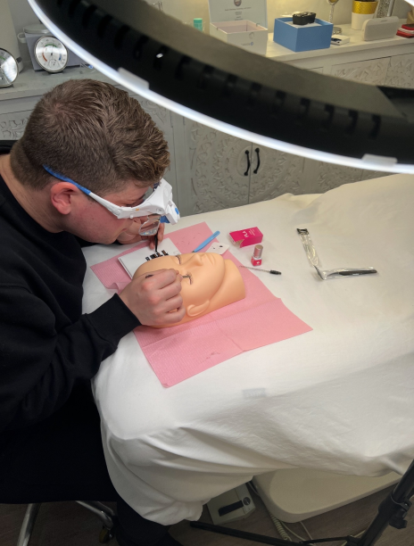 Travis applying lash extensions